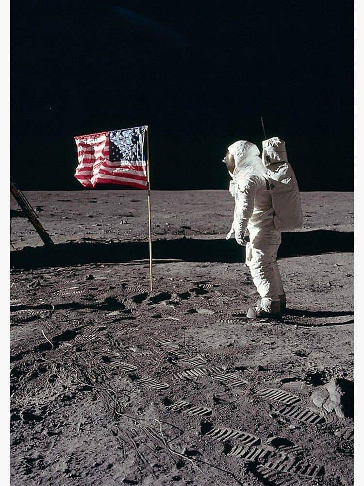 Buzz Aldrin on the moon with the American flag