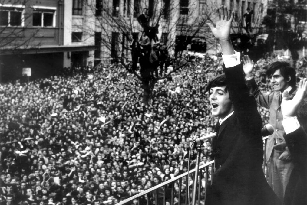 Beatles with their fans